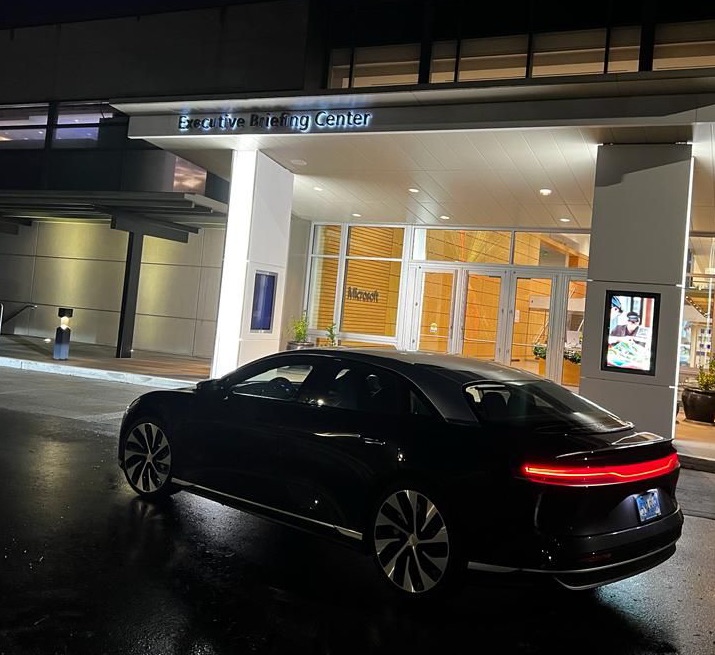 Black Sedan Running at night