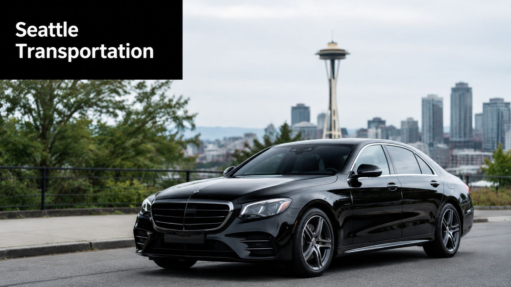 A black luxury Mercedes-Benz sedan parked in Seattle with the Space Needle visible in the background.