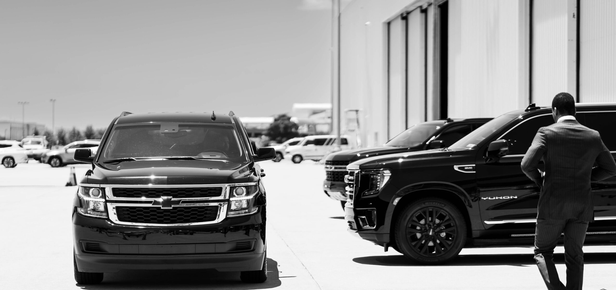 Corporate transportation Seattle chauffeur and black sedan